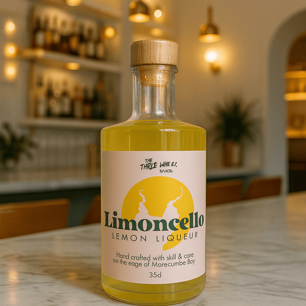 Limoncello lemon liqueur bottle on a marble table, handcrafted on the edge of Morecambe Bay.