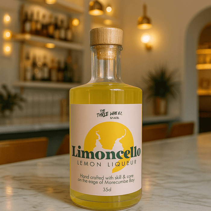 Limoncello lemon liqueur bottle on a marble table, handcrafted on the edge of Morecambe Bay.
